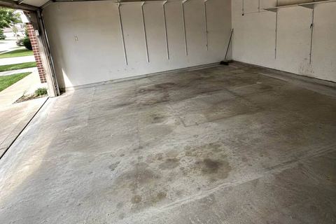 An emptied garage swept clean after a cleanout